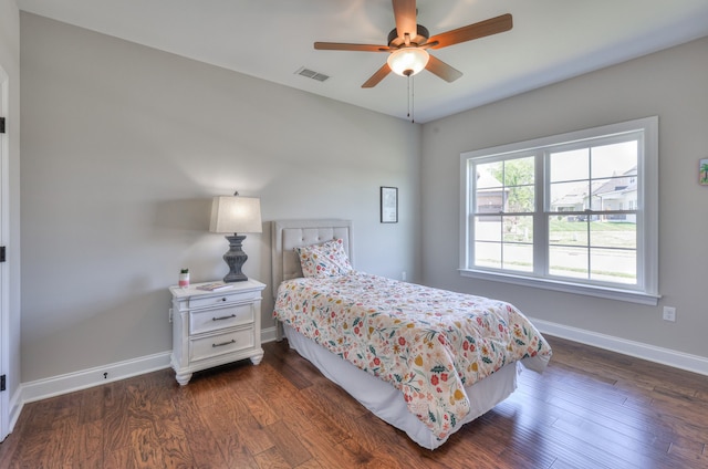 bedroom featuring dark hardwood / wood-style flooring and ceiling fan