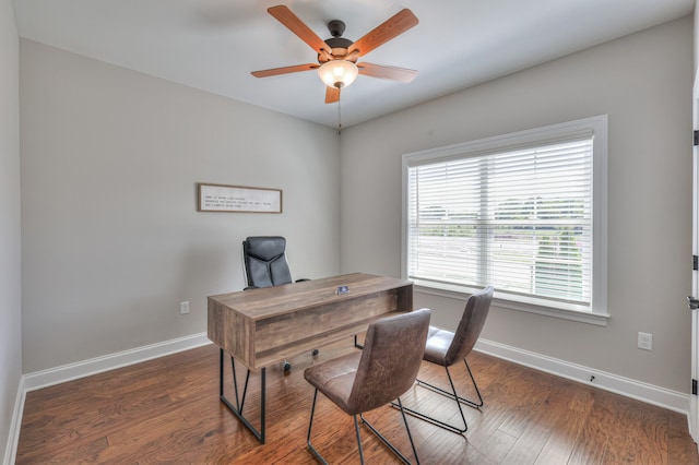 office with dark hardwood / wood-style flooring and ceiling fan