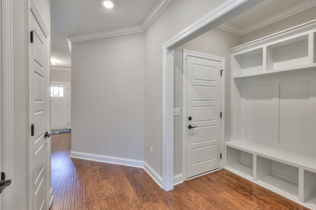 mudroom with ornamental molding and dark hardwood / wood-style floors