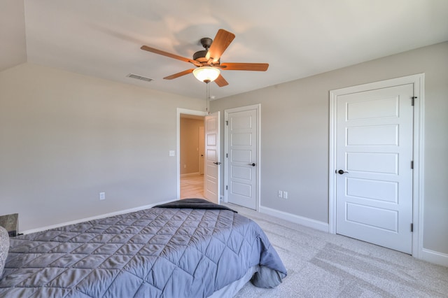 bedroom featuring ceiling fan and carpet