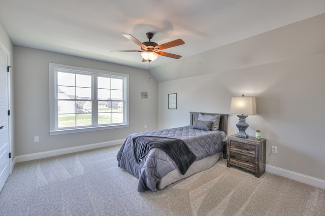 bedroom featuring carpet, ceiling fan, and vaulted ceiling