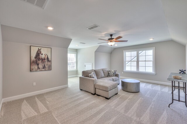 interior space featuring lofted ceiling and ceiling fan