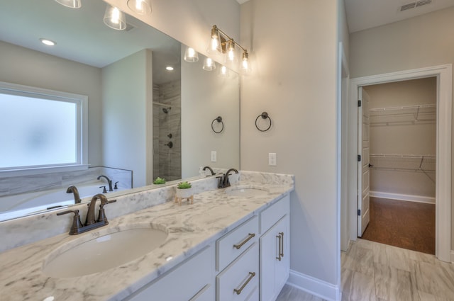 bathroom featuring tile flooring and double sink vanity