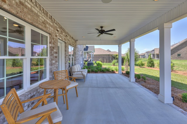 view of patio featuring ceiling fan