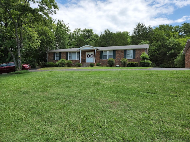 ranch-style home with a front lawn