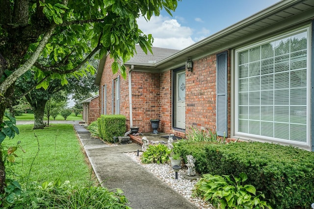 view of property exterior with a yard