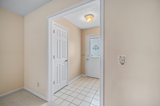 entryway with light tile flooring