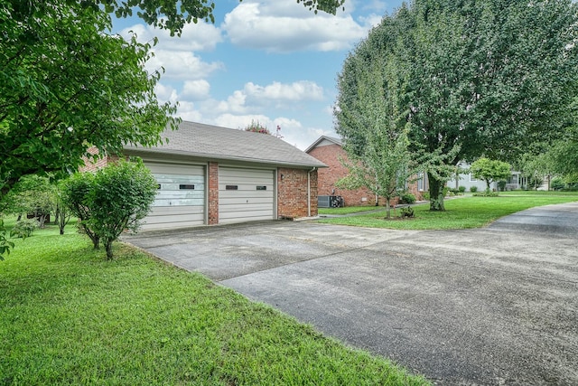 view of front facade with a front lawn and a garage