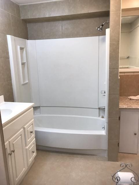 bathroom featuring shower / tub combination, tile floors, and vanity