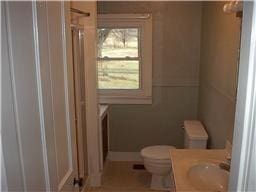 bathroom with toilet and vanity