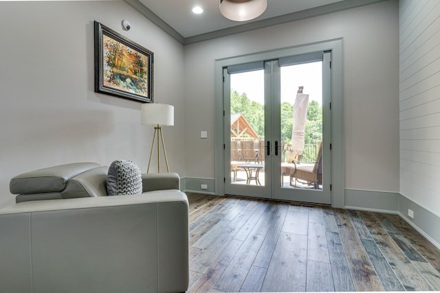 entryway featuring french doors, ornamental molding, and wood-type flooring