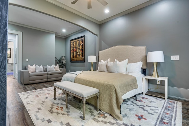 bedroom featuring crown molding, ceiling fan, and dark wood-type flooring