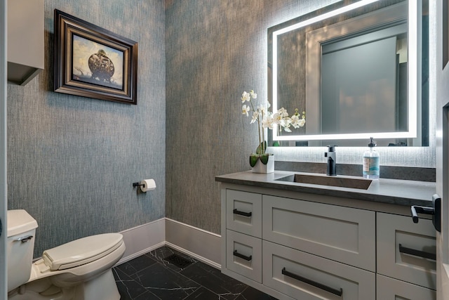 bathroom featuring toilet, tile floors, and vanity