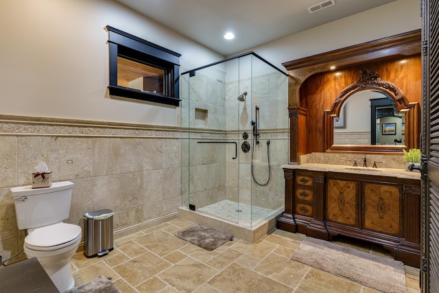 bathroom featuring an enclosed shower, vanity, tile flooring, toilet, and tasteful backsplash