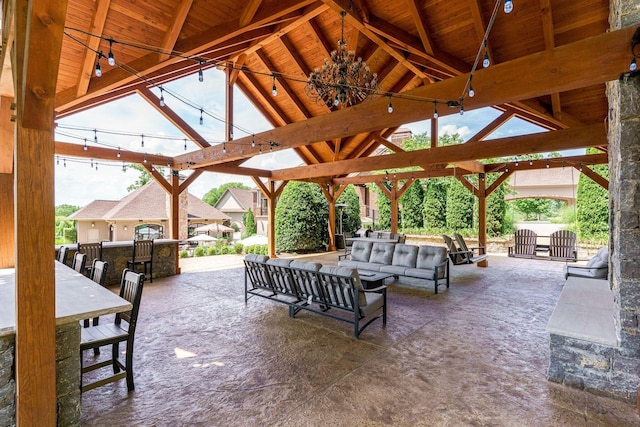 view of terrace with a gazebo and an outdoor hangout area