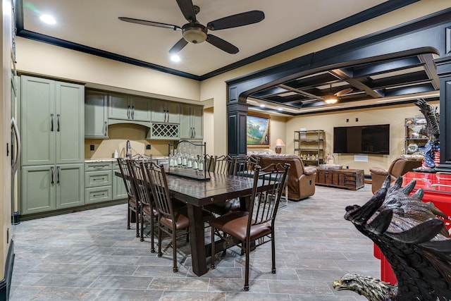 dining space featuring coffered ceiling, ceiling fan, and ornamental molding