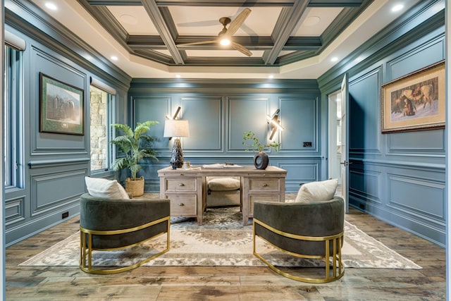 sitting room with coffered ceiling, hardwood / wood-style flooring, and crown molding