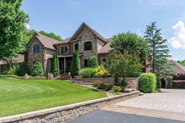 craftsman house with a front lawn