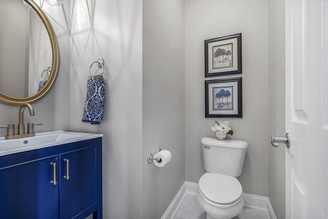 bathroom featuring tile floors, vanity with extensive cabinet space, and toilet