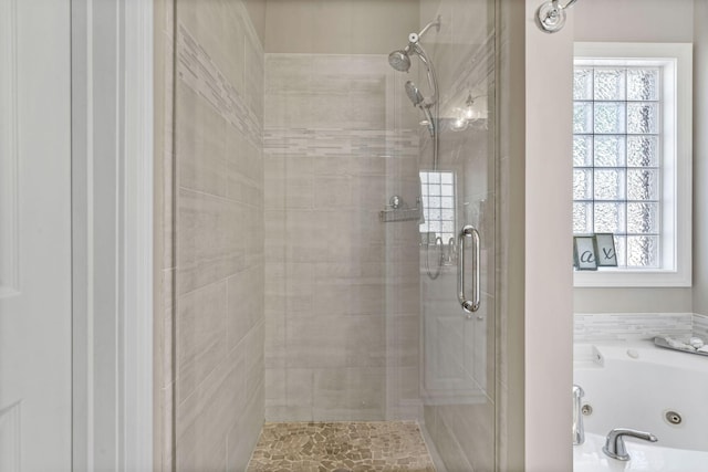 bathroom featuring a shower with shower door