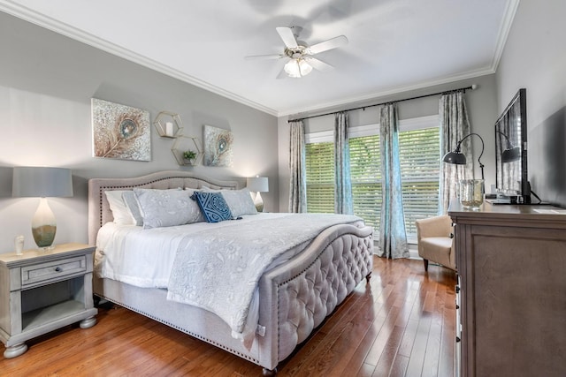 bedroom with ceiling fan, crown molding, and wood-type flooring