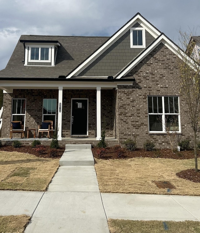 craftsman-style home with covered porch