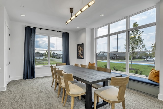 view of carpeted dining space