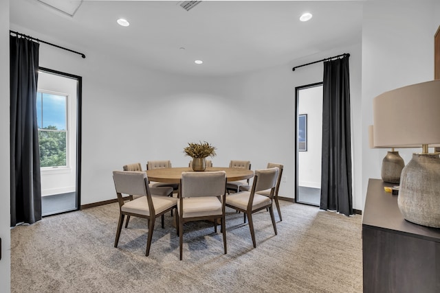 view of carpeted dining space