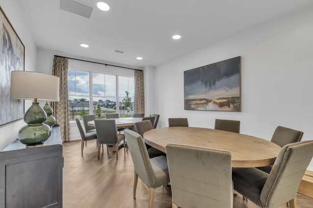 dining area featuring recessed lighting, visible vents, and wood finished floors
