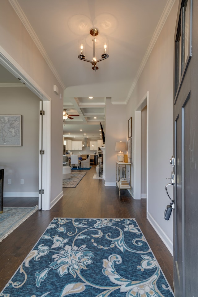 entryway featuring coffered ceiling, beam ceiling, dark wood-type flooring, and crown molding