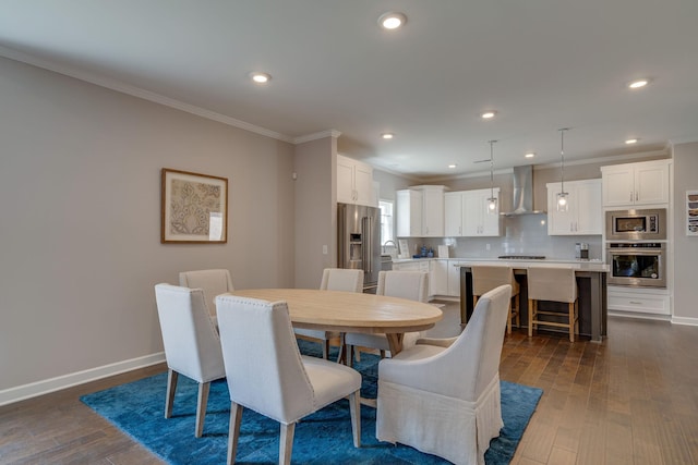 dining room featuring recessed lighting, baseboards, ornamental molding, and dark wood finished floors