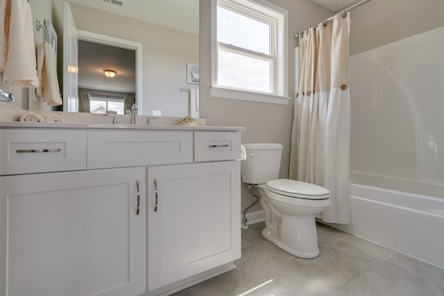 full bathroom featuring shower / bath combination with curtain, vanity, plenty of natural light, and toilet