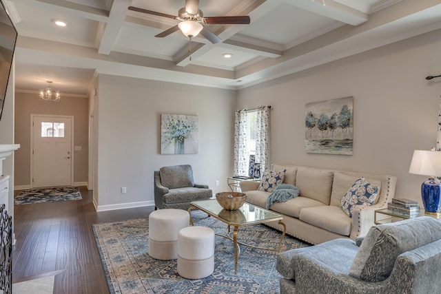 living room with dark wood-style flooring, crown molding, beam ceiling, ceiling fan with notable chandelier, and coffered ceiling