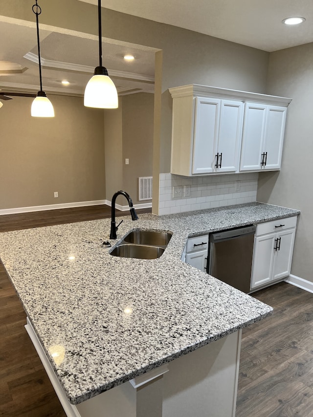 kitchen with backsplash, sink, dishwasher, and dark hardwood / wood-style flooring