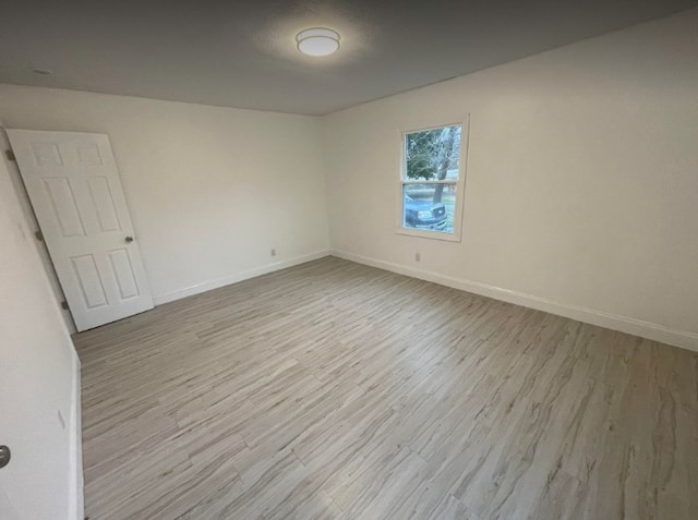 unfurnished room featuring light wood-type flooring