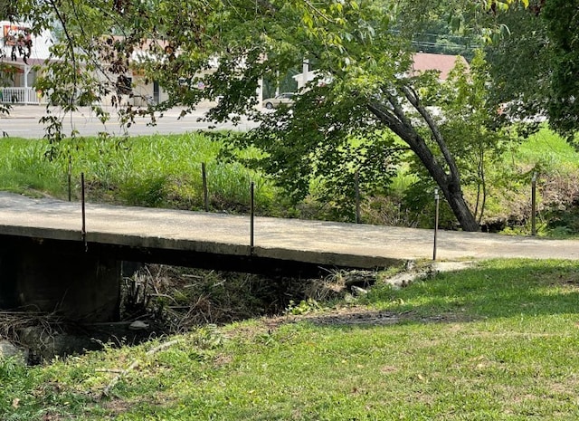 view of side of property with a lawn