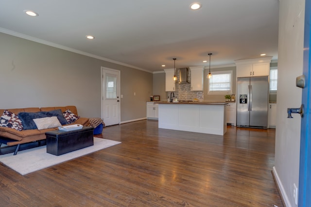 living room featuring ornamental molding and dark wood-type flooring