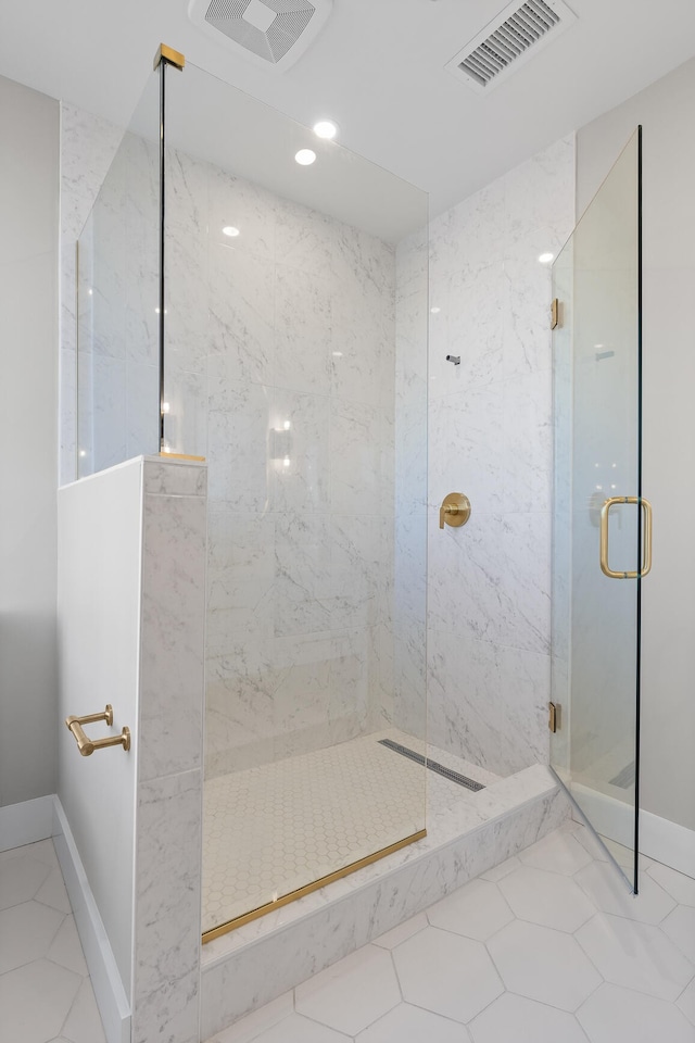 bathroom with tile patterned flooring and walk in shower