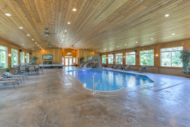 view of pool featuring ceiling fan and a water slide