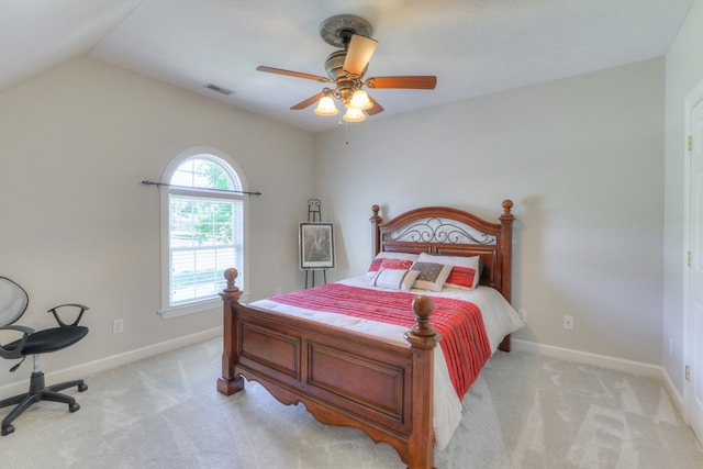 carpeted bedroom featuring vaulted ceiling and ceiling fan