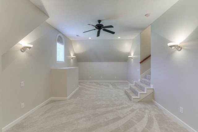 interior space featuring ceiling fan and lofted ceiling