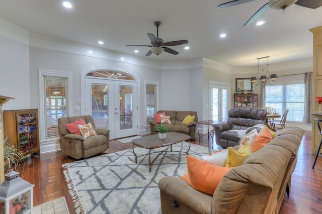 living room featuring ceiling fan, dark wood-type flooring, ornamental molding, and french doors