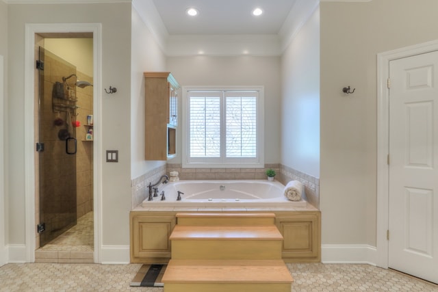 bathroom featuring tile floors, ornamental molding, and separate shower and tub