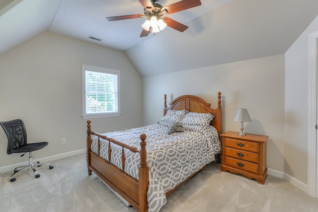 carpeted bedroom with ceiling fan and vaulted ceiling