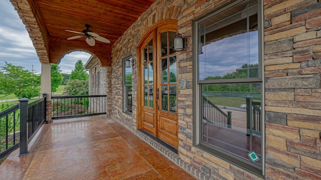 exterior space featuring ceiling fan and french doors