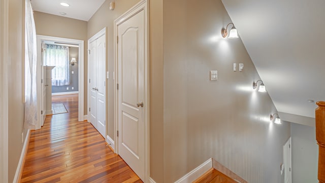 hall with light hardwood / wood-style flooring