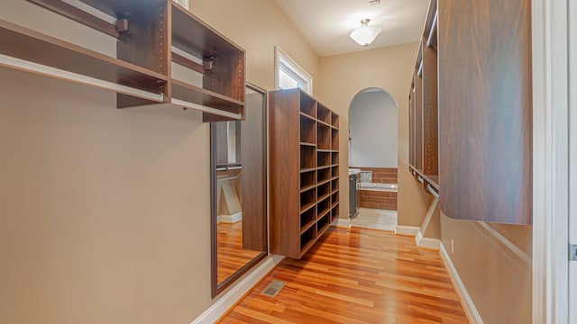 walk in closet featuring light wood-type flooring