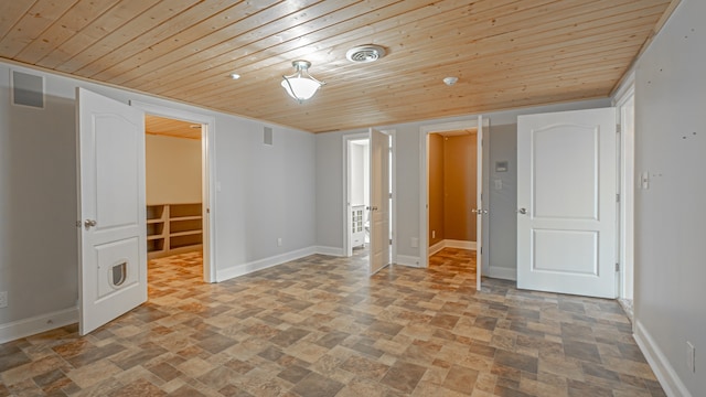 tiled empty room with wooden ceiling