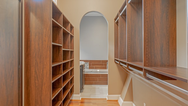 walk in closet featuring light wood-type flooring