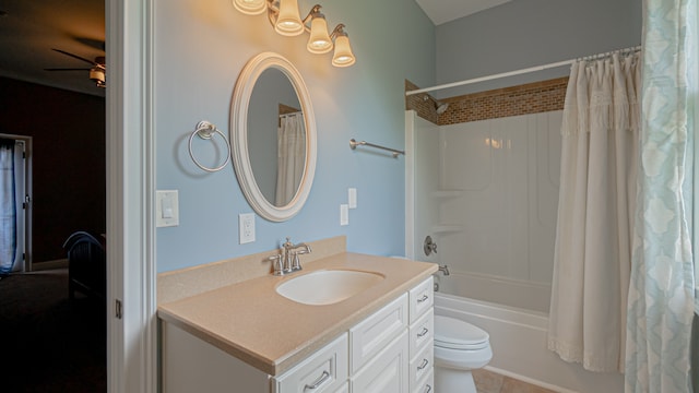 full bathroom with tile floors, ceiling fan, toilet, shower / bath combo, and vanity